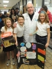 Bishop Richard Malone stands with Shark Award winners; Christ of King Catholic School fifth graders Madeline Carr, Tony Lana and Lillian Colpoys during the Diocese of Buffalo 3rd Annual X-Stream Games and Expo. Area Catholic elementary and middle school s